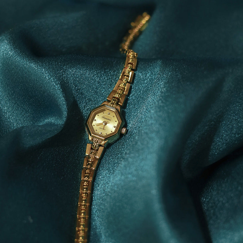 woman Golden Watch - gentle 