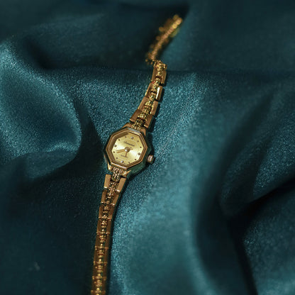 woman Golden Watch - gentle 