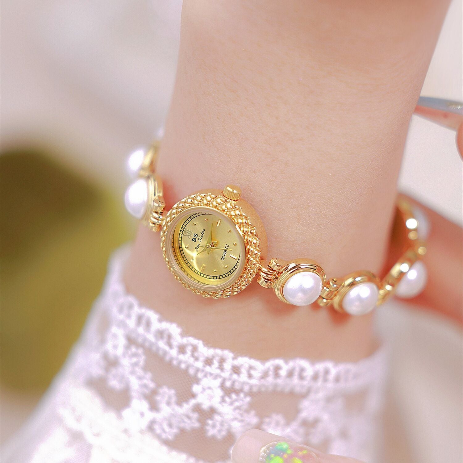 woman pearls bracelet watch gold 